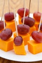 Perfect party snacks. Cheese cubes with grapes Royalty Free Stock Photo