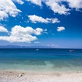 Perfect pebbles beach and blue sky with clouds Royalty Free Stock Photo