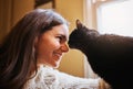 The perfect picture of domestic bliss. an attractive young woman bonding with her cat at home.