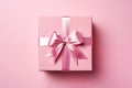 Perfect pink gift box on pink pastel background.