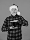 Perfect present. Calling Santa. Man with long beard hold cell phone. Santa holding mobile phone orange background Royalty Free Stock Photo