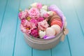 Perfect present, flower composition with macaroons in craft box