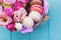 Perfect present, flower composition with macaroons in craft box