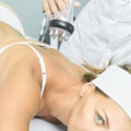 Perfect radio treatment. Woman at spa procedure. Doctor hand and girl body. RF cosmetology lifting. Back body