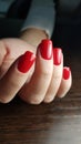 Perfect Red gel polish Christmas nails Royalty Free Stock Photo