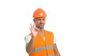 Perfect repairing guaranteed. man in helmet show ok gesture. successful worker in hardhat. wear hard hat to protect