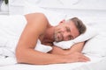 Perfect rest. Sleeping beauty. Man handsome guy lay in bed. Get enough amount of sleep every night. Tips sleeping better Royalty Free Stock Photo