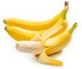 Perfect ripe yellow bananas and one peeled banana isolated on white background Royalty Free Stock Photo