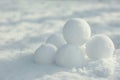 Perfect round snowballs on snow outdoors, closeup