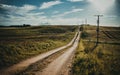 Perfect rural landscape view with an unpaved road disappearing into the horizon