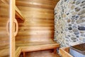 Perfect sauna room with wood walls and bench. Royalty Free Stock Photo