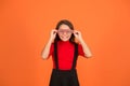 Perfect for school party. Happy party girl orange background. Little kid wear party glasses. Small child smile with