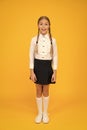 Perfect schoolgirl. Small schoolgirl with happy smile. Little schoolgirl looking nice in school uniform. Cute schoolgirl