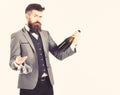 Perfect service, good manners, alcohol concept. Waiter with elegant suit, bow tie and handsome face. Mature man holds Royalty Free Stock Photo