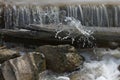 A perfect shot of water cascading over a small waterfall Royalty Free Stock Photo