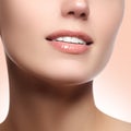 Perfect smile with white healthy teeth and natural full lips, dental care concept. Beautiful young woman's face fragment