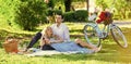 Perfect spring date. Idyllic moment in garden. Man and woman in love. Couple sit blanket. Happy together. Romantic