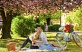 Perfect spring date. Man and woman in love. Picnic time. Long lasting relationship. Couple having picnic in local park