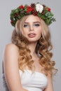 Perfect stylish lady with makeup, long shiny wavy hairdo on white background. Christmas woman portrait Royalty Free Stock Photo