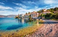 Perfect summer cityscape of Fiskardo town with Zavalata Beach. Stunning morning seascape of Ionian Sea.