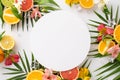 The perfect summer combination. Top view flat lay of alstroemeria flowers with sliced oranges, grapefruit, lime, and lemon on a Royalty Free Stock Photo