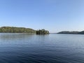 Perfect summer day by the lake with islands in the horizon Royalty Free Stock Photo