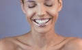 Perfect teeth smile with shiny lips. Beautiful close-up of a tanned face of a young woman with clean fresh skin. Royalty Free Stock Photo