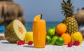 Perfect tropical cocktail juice with a paper parasol and fresh fruits on a beach Royalty Free Stock Photo