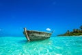 Perfect tropical island paradise beach and old boat