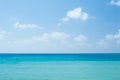 Perfect tropical white sandy beach and turquoise clear ocean water - summer vacation natural background with blue sunny sky