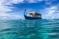 05.28.19 - Maldives island, Ari atoll: Dhoni boat view from sea. Maldivian wooden boat for tourist and travel transportation Royalty Free Stock Photo