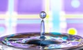 Perfect water droplet on light blue and violet background - water issues, water shortage, resources