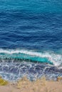 Perfect wave conditions on a sunny beach, with crystal clear blue waters Royalty Free Stock Photo