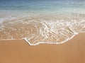 The perfect wave touches the perfect sand Royalty Free Stock Photo