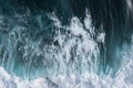 Perfect waves for surfing. The waves splash into the turquoise water off the coast. Royalty Free Stock Photo