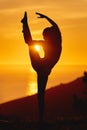 The perfect way to end off the day. Full length shot of an unrecognizable and athletic young woman practicing yoga Royalty Free Stock Photo