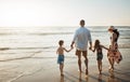 The perfect way to end a Sunday. a family of four spending the day at the beach. Royalty Free Stock Photo