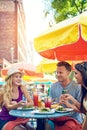 The perfect way to kickstart summer. three young friends sitting at an outdoor cafe.