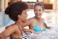 The perfect way to spend your vacation. two gorgeous young women in a jacuzzi. Royalty Free Stock Photo