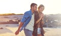 The perfect weather for a walk on the beach. a happy young couple going for a walk along the beach. Royalty Free Stock Photo