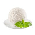 Perfect white creamy ice cream scoop with fresh green mint on white plate isolated, closeup.