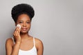 Perfect woman cleaning her face with cotton pads over white background Royalty Free Stock Photo