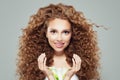 Perfect woman with long curly brown hair, healthy skin and lily flower in her hands Royalty Free Stock Photo