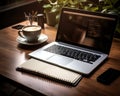 The perfect work nook laptop coffee and writing essentials on a stylish wooden surface, business meeting photo