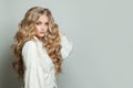 Perfect young woman with long blonde healthy curly hairdo on white background Royalty Free Stock Photo