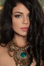 Perfect Young Woman with Long Curly Hair and Green Necklace Royalty Free Stock Photo