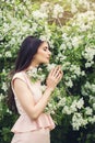 Perfect young woman smelling flower in blossom spring flowers Royalty Free Stock Photo