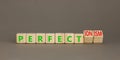 Perfectionism symbol. Concept words Perfect or Perfectionism beautiful wooden blocks. Beautiful grey table grey background.