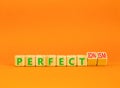 Perfectionism symbol. Concept words Perfect or Perfectionism beautiful wooden blocks. Beautiful orange table orange background.