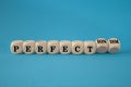 Perfectionism symbol. Concept words Perfect or Perfectionism on beautiful wooden cubes. Beautiful blue table blue background.